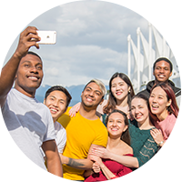Group of teens happily taking selfies